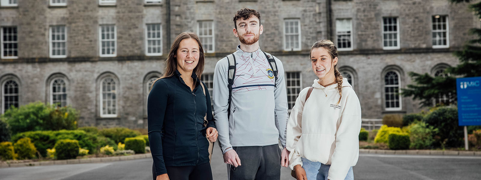 Three students standing outside MIC Thurles campus