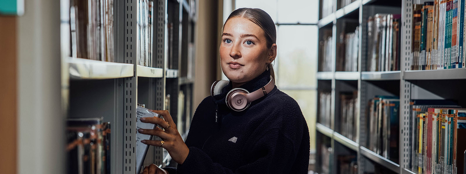 Female student in the library at MIC Thurles