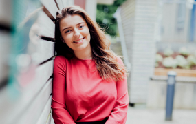 Girl with brown hair standing outside on MIC's Limerick campus