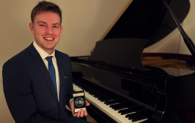 Edmond Gubbins with his Medal of Excellence