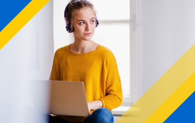 Female student sitting in front of laptop