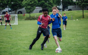 CBS' Mduduzi Ncube and Le Cheile's Thomas Ryan jostle for the ball