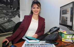 Áine Fitzgerald sitting at her desk