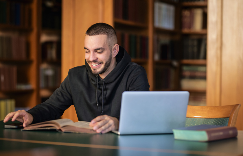 Male learner sitting at laptop