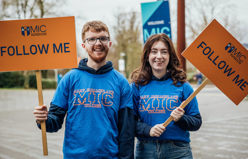 Male and female student pictured at an open day