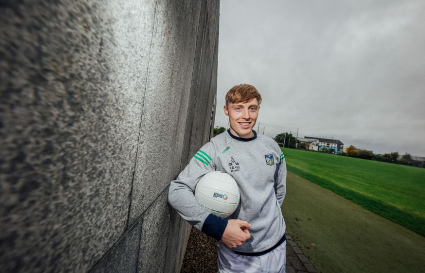 Padraig de Brun in a Limerick jumper holding a football