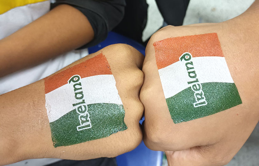 Two bumping fists with Irish flag tattoos 