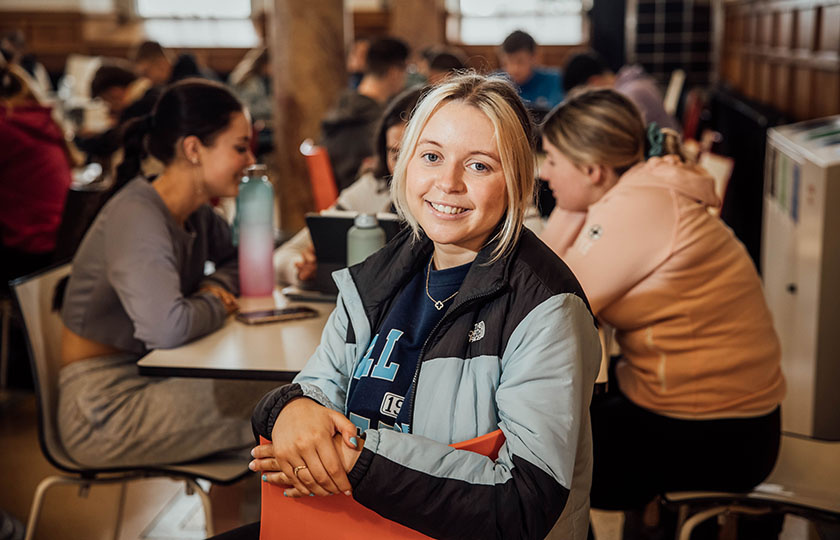 Female student sitting in the College canteen 