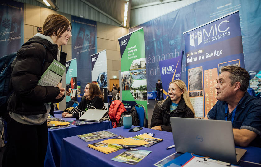 Student talking to MIC staff at a stand on MIC Limerick Open Day