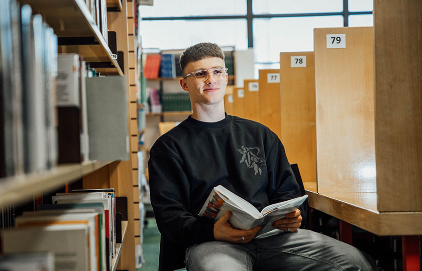 Student in library at MIC