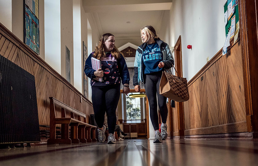 Two female students in the MIC Thurles hallway